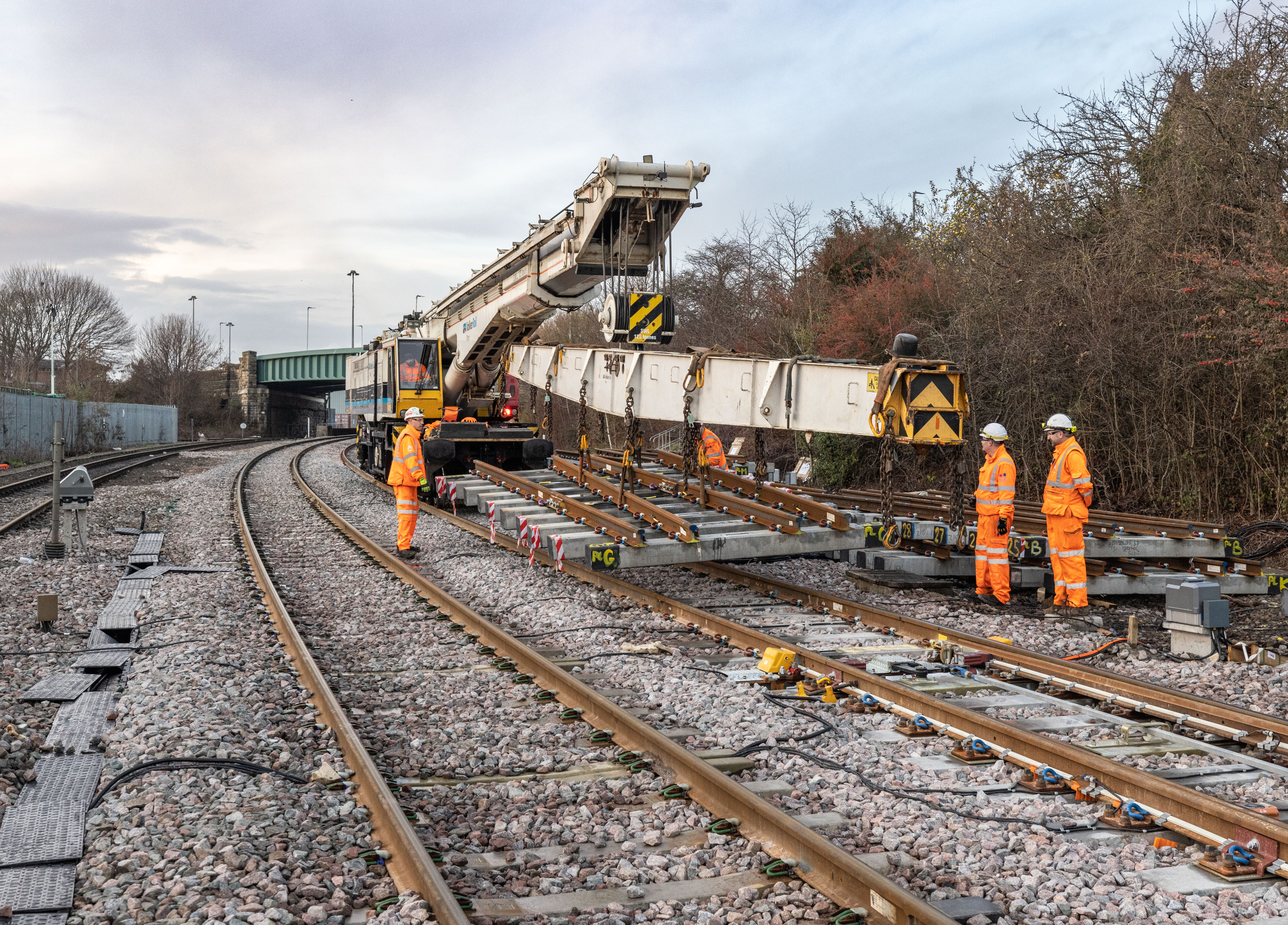 A Kirow crane installing track